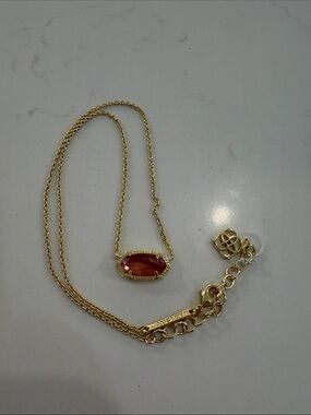 Kendra Scott Gold Necklace with Deep Coral Oval Stone